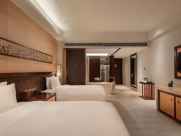Wanda Realm Resort Sanya Haitang Bay : photo 4 de la chambre chambre lits jumeaux - vue sur jardin