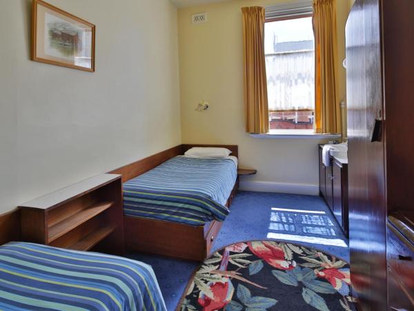 Astor Private Hotel : photo 1 de la chambre chambre lits jumeaux standard avec salle de bains commune