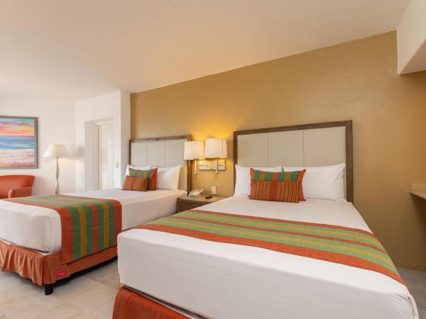 Tesoro Ixtapa Beach Resort : photo 2 de la chambre chambre double/lit king-size de luxe avec vue partielle océan
