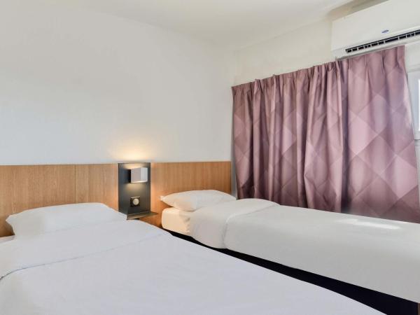 B&B HOTEL Béziers : photo 1 de la chambre chambre lits jumeaux