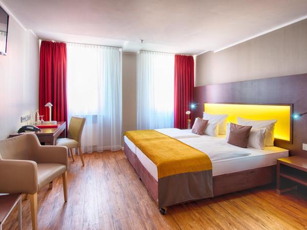 Leonardo Hotel München City Center : photo 1 de la chambre chambre deluxe double ou lits jumeaux