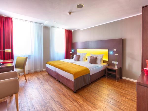 Leonardo Hotel München City Center : photo 4 de la chambre chambre deluxe double ou lits jumeaux