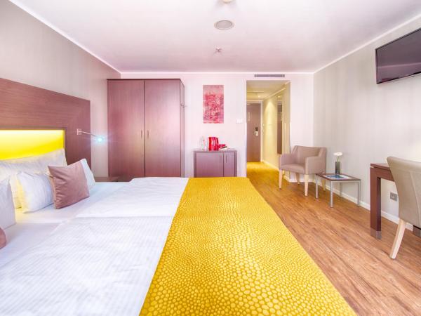 Leonardo Hotel München City Center : photo 5 de la chambre chambre deluxe double ou lits jumeaux