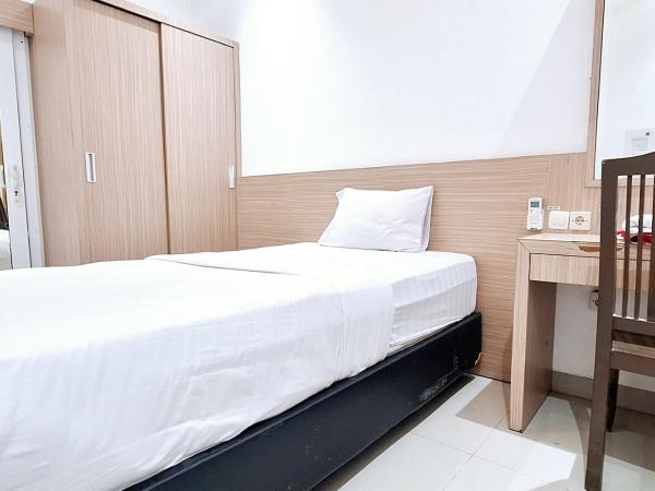 Urbanview Hotel Syariah Hapsari YIA : photo 1 de la chambre chambre simple deluxe