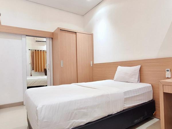 Urbanview Hotel Syariah Hapsari YIA : photo 3 de la chambre chambre simple deluxe