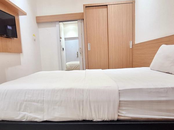 Urbanview Hotel Syariah Hapsari YIA : photo 4 de la chambre chambre simple deluxe