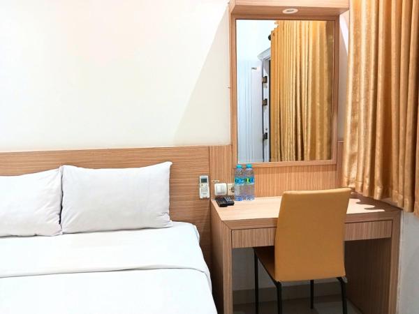 Urbanview Hotel Syariah Hapsari YIA : photo 1 de la chambre chambre double deluxe