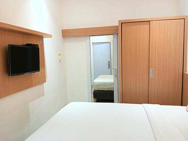 Urbanview Hotel Syariah Hapsari YIA : photo 2 de la chambre chambre double deluxe