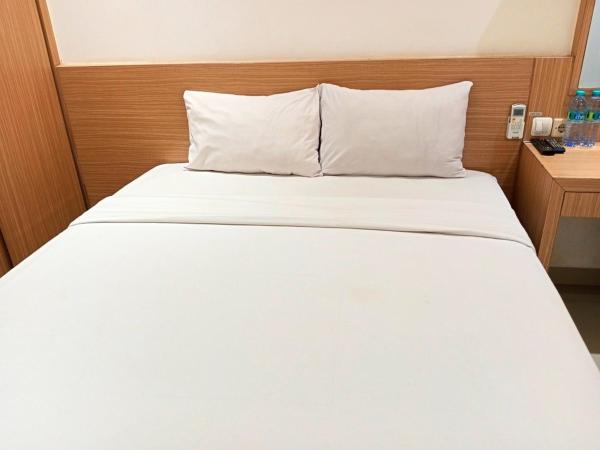 Urbanview Hotel Syariah Hapsari YIA : photo 4 de la chambre chambre double deluxe