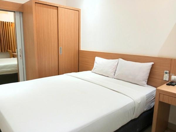 Urbanview Hotel Syariah Hapsari YIA : photo 5 de la chambre chambre double deluxe