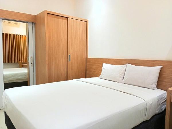 Urbanview Hotel Syariah Hapsari YIA : photo 7 de la chambre chambre double deluxe