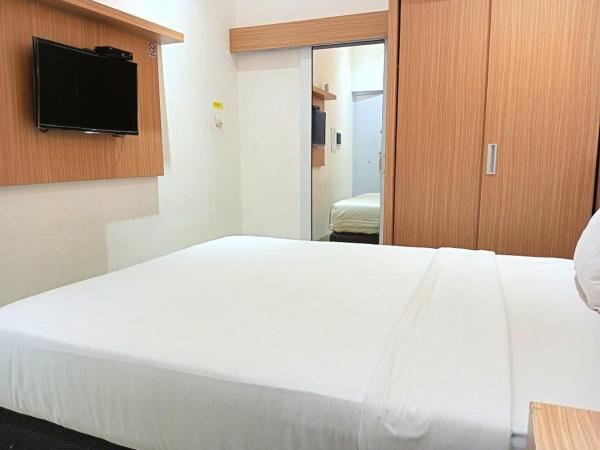 Urbanview Hotel Syariah Hapsari YIA : photo 9 de la chambre chambre double deluxe