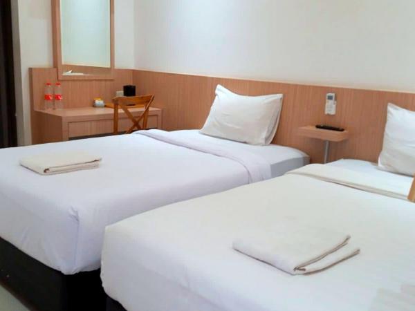 Urbanview Hotel Syariah Hapsari YIA : photo 1 de la chambre chambre lits jumeaux deluxe