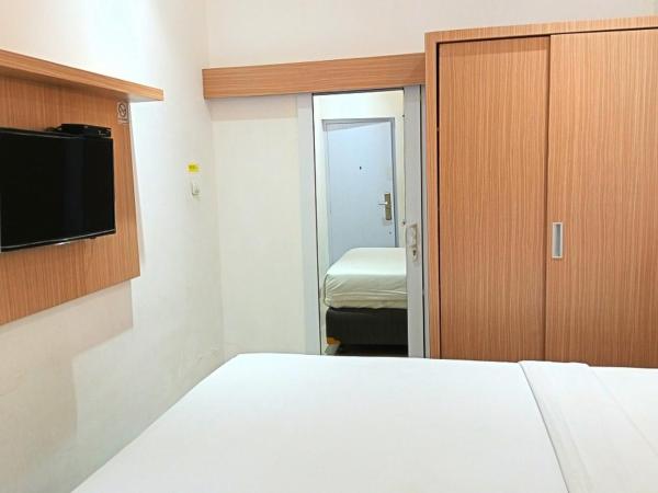Urbanview Hotel Syariah Hapsari YIA : photo 4 de la chambre chambre lits jumeaux deluxe