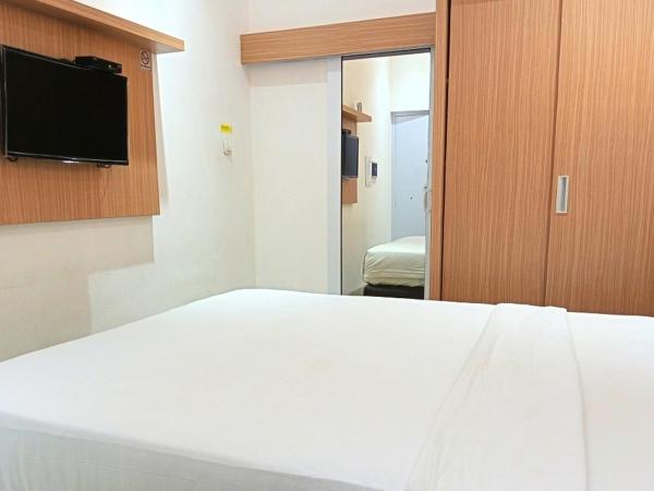 Urbanview Hotel Syariah Hapsari YIA : photo 6 de la chambre chambre lits jumeaux deluxe
