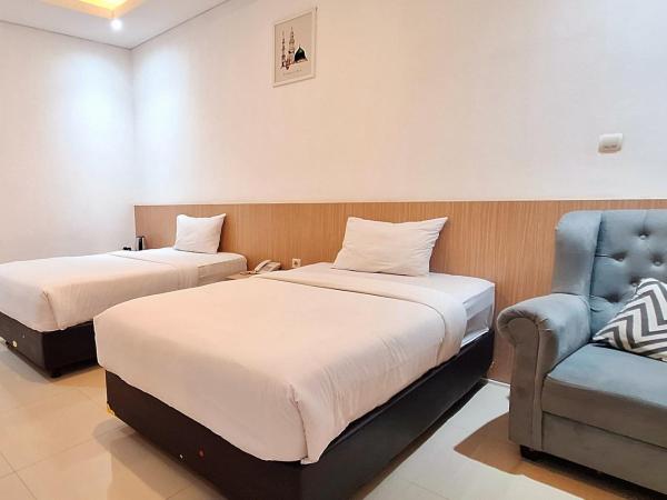 Urbanview Hotel Syariah Hapsari YIA : photo 1 de la chambre chambre lits jumeaux deluxe