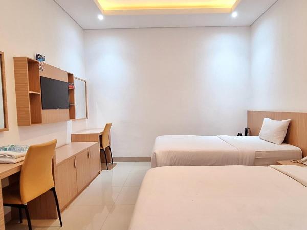 Urbanview Hotel Syariah Hapsari YIA : photo 2 de la chambre chambre lits jumeaux deluxe