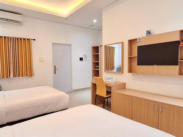 Urbanview Hotel Syariah Hapsari YIA : photo 6 de la chambre chambre lits jumeaux deluxe