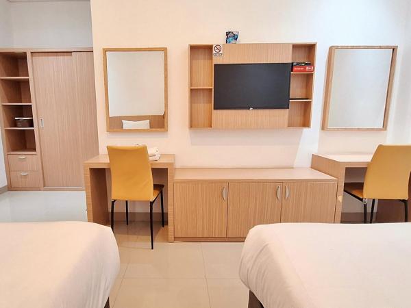 Urbanview Hotel Syariah Hapsari YIA : photo 8 de la chambre chambre lits jumeaux deluxe