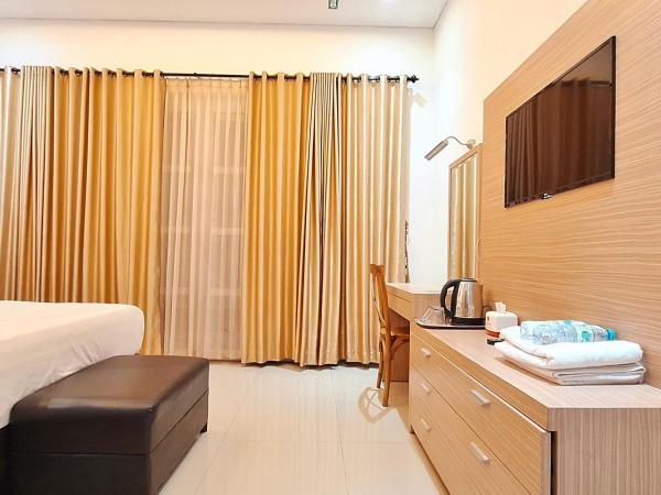 Urbanview Hotel Syariah Hapsari YIA : photo 7 de la chambre suite