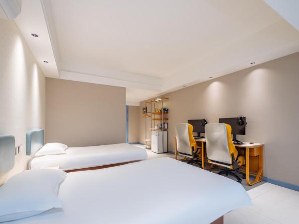 网鱼电竞酒店(竹山路地铁站店) : photo 3 de la chambre chambre lits jumeaux