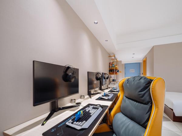 网鱼电竞酒店(竹山路地铁站店) : photo 7 de la chambre chambre triple