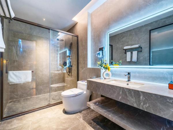 Henghe Selected S Design Hotel - flagship store of Guangzhou Baiyun Railway Station International Convention Center : photo 5 de la chambre movie queen room  