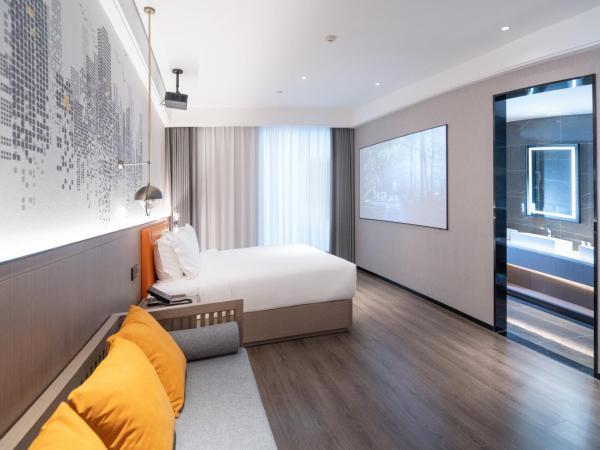 Mehood Hotel Xi'an High-tech Software New City International Conference Center : photo 1 de la chambre double room with movie