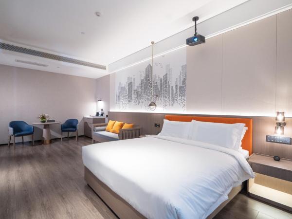 Mehood Hotel Xi'an High-tech Software New City International Conference Center : photo 2 de la chambre double room with movie