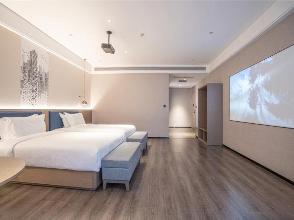 Mehood Hotel Xi'an High-tech Software New City International Conference Center : photo 1 de la chambre twin room with movie