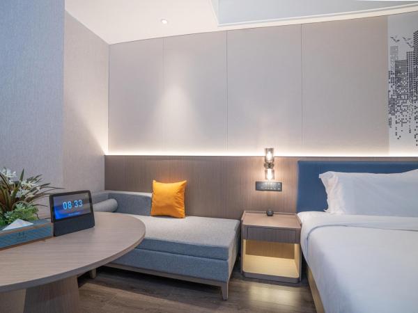 Mehood Hotel Xi'an High-tech Software New City International Conference Center : photo 3 de la chambre twin room with movie