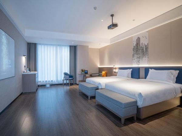 Mehood Hotel Xi'an High-tech Software New City International Conference Center : photo 4 de la chambre twin room with movie