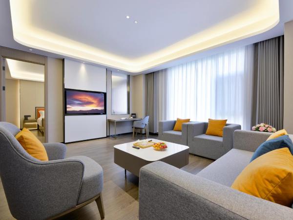 Mehood Hotel Xi'an High-tech Software New City International Conference Center : photo 1 de la chambre suite affaires