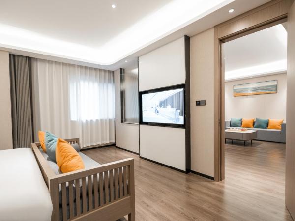 Mehood Hotel Xi'an High-tech Software New City International Conference Center : photo 2 de la chambre suite affaires