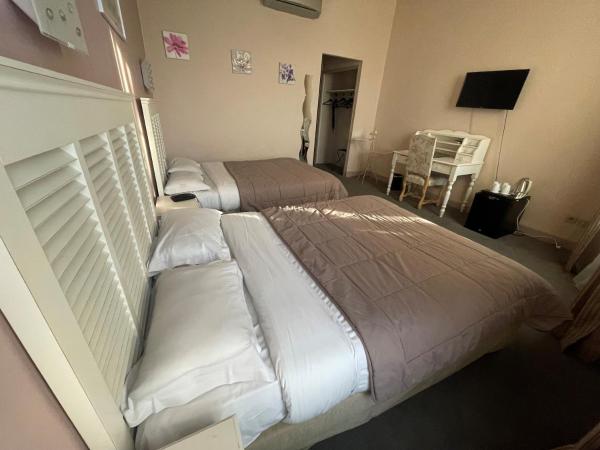 Hotel De France : photo 3 de la chambre chambre quadruple