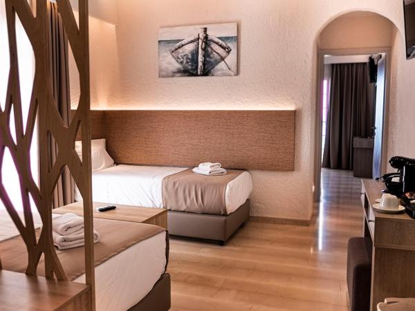 Porto Greco Village Beach Hotel : photo 5 de la chambre chambre familiale de luxe deux chambres 