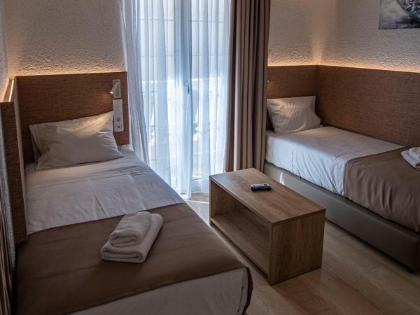 Porto Greco Village Beach Hotel : photo 1 de la chambre chambre familiale de luxe deux chambres 