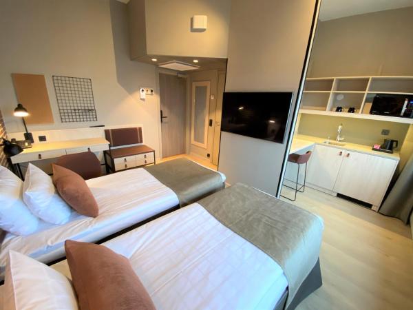 Skyline Airport Hotel : photo 8 de la chambre chambre lits jumeaux standard avec kitchenette
