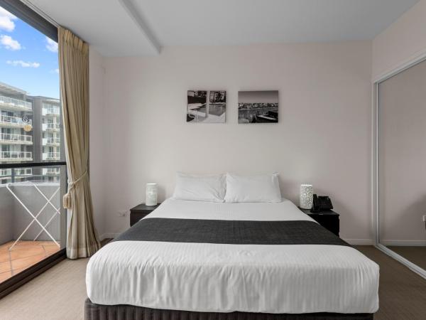 The Oasis Apartments : photo 2 de la chambre appartement 2 chambres avec 2 lits queen-size