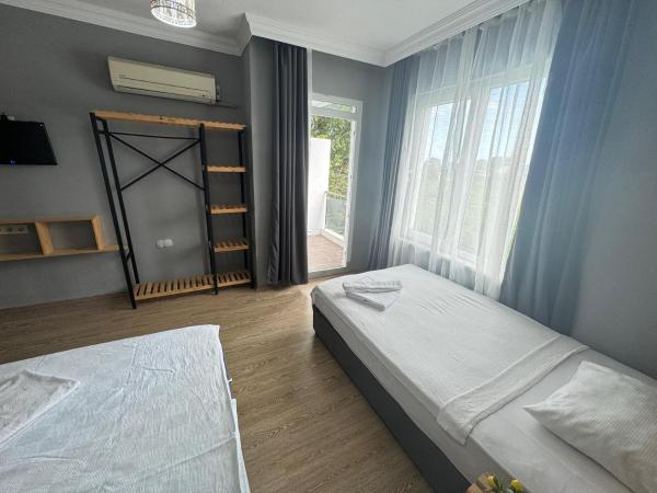 GÜLER BUTİK HOTEL : photo 2 de la chambre chambre triple Économique