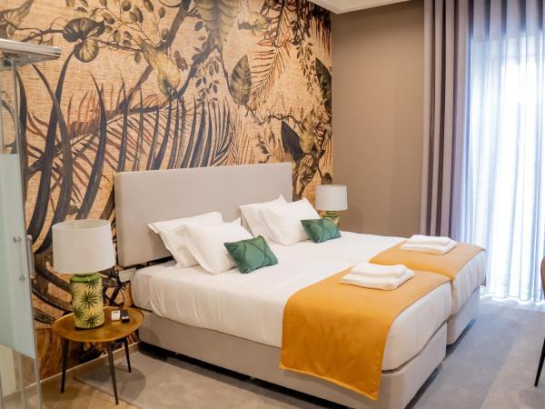 Guest House Jacarandá Faro : photo 5 de la chambre chambre lits jumeaux