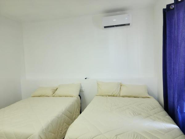 JESAVI Suites : photo 1 de la chambre chambre deluxe avec 2 lits doubles