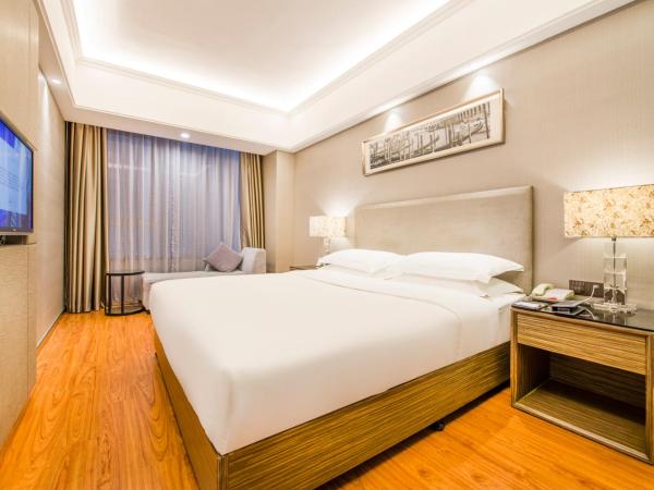 La Perle International Hotel - Free shuttle between hotel and Exhibition Center during Canton Fair & Exhibitor registration Counter : photo 1 de la chambre chambre supérieure lit queen-size
