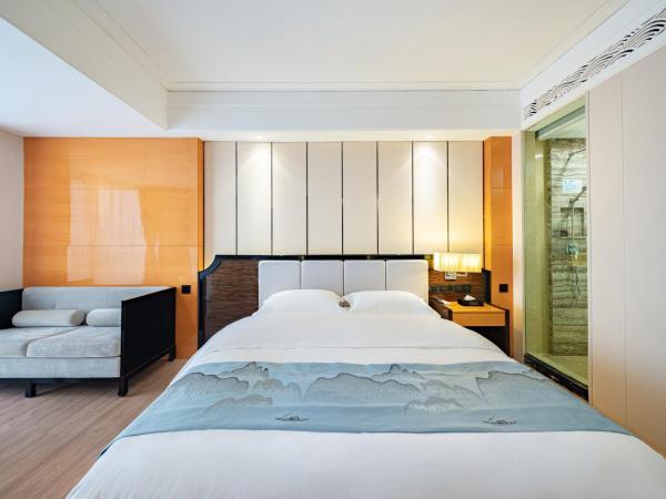 Evening Breeze Hotel 晚风酒店 : photo 4 de la chambre city view executive king room