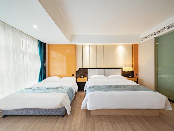 Evening Breeze Hotel 晚风酒店 : photo 2 de la chambre city view family twin room