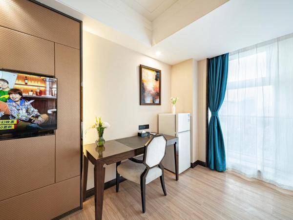 Evening Breeze Hotel 晚风酒店 : photo 5 de la chambre city view family twin room