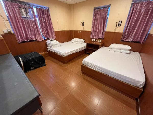 New Garden Hostel : photo 1 de la chambre chambre quadruple avec salle de bains commune