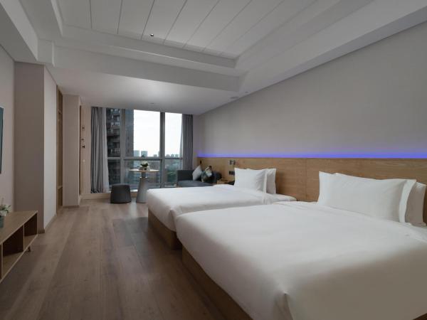 Westlake Art Hotel -Xiasha University Town Branch : photo 2 de la chambre chambre lits jumeaux deluxe
