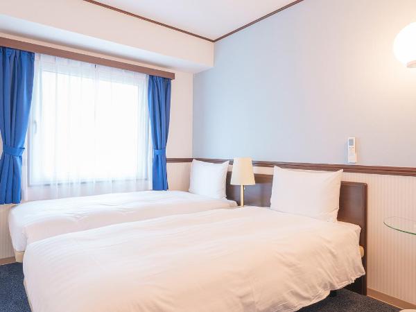 Toyoko Inn Shin-Osaka-eki Higashi-guchi : photo 1 de la chambre chambre lits jumeaux standard - fumeurs