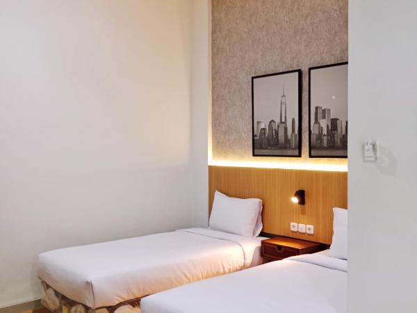 Andita Syariah Hotel : photo 1 de la chambre chambre lits jumeaux deluxe